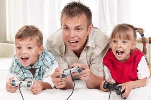 2200364-happy-family-father-and-children-playing-a-video-game